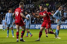 Will Keane (right) celebrates scoring his side's second goal 