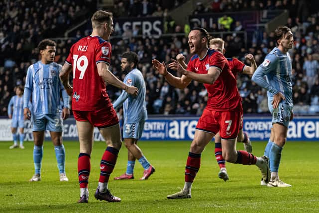 Will Keane (right) celebrates scoring his side's second goal