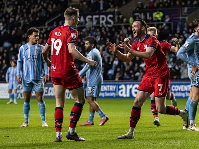 Will Keane (right) celebrates scoring his side's second goal 