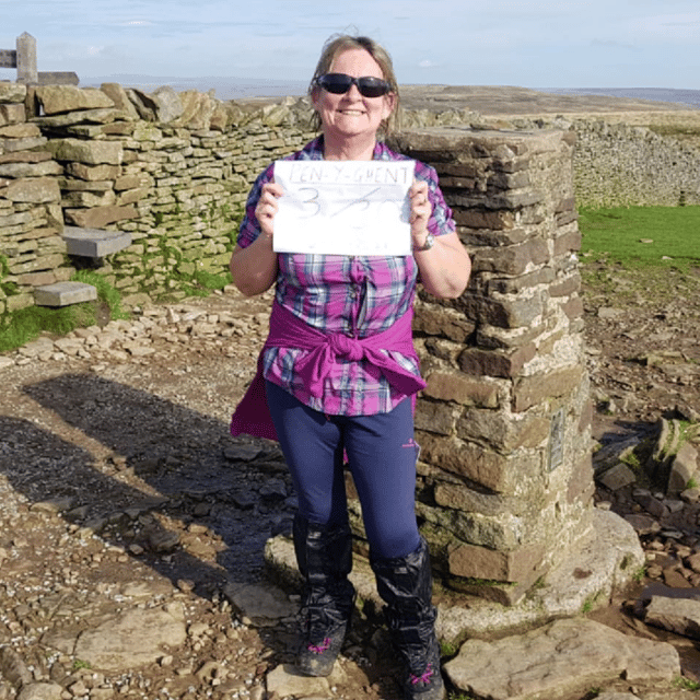 Jackie at the summit of Pen Y Gent.
