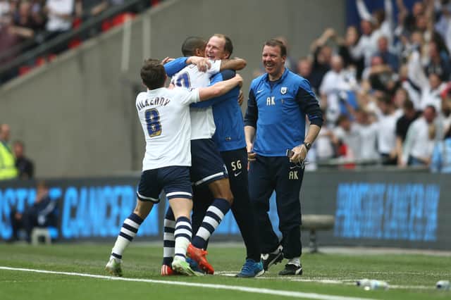 Simon Grayson celebrates with Jermaine Beckford after the striker's goal against Swindon in the 2015 League One play-off final 