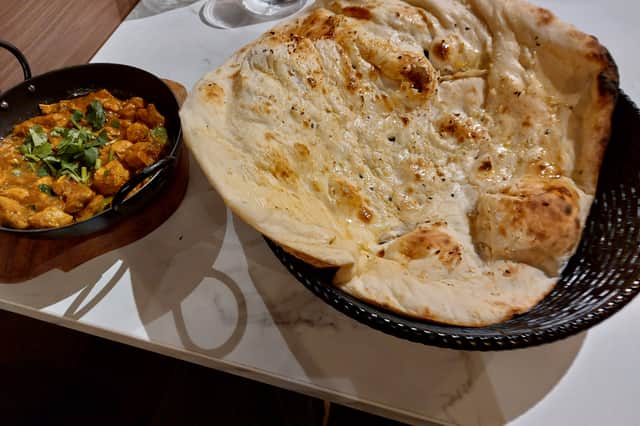 A picture of the chicken karahi and garlic naan served at Akbar's