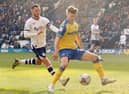 Stoke City's Luke McNally shields the ball 