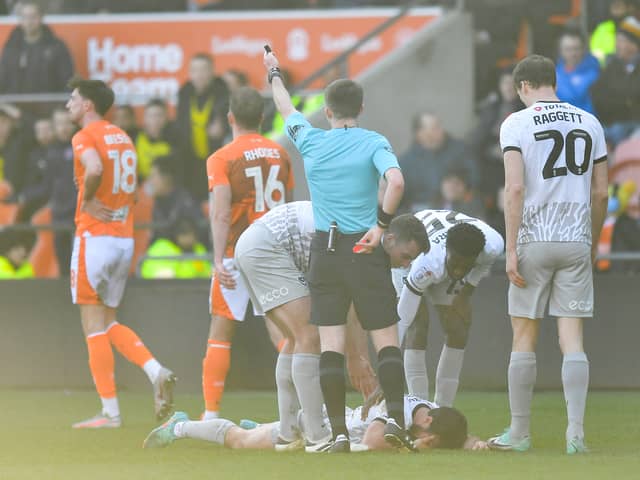 Blackpool's Jordan Rhodes is shown the red card