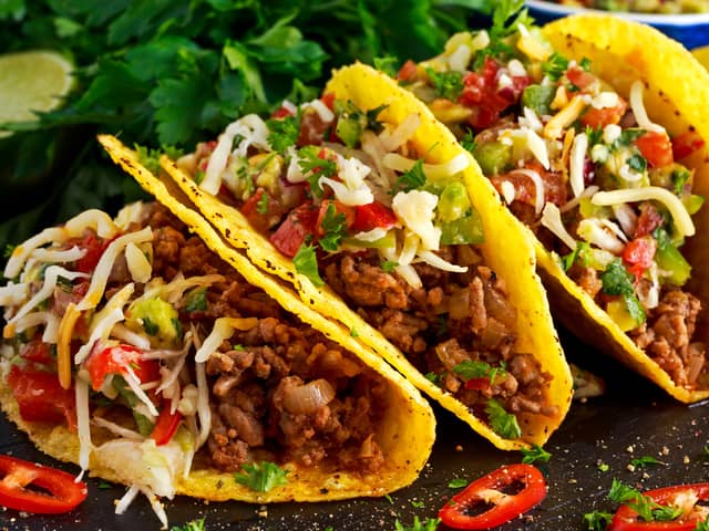 Mexican food - delicious taco shells with ground beef and home made salsa. Image: Grinchh/stock.adobe