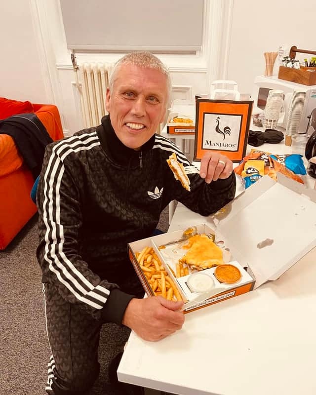 Happy Monday's star Bez enjoying a takeaway from Manjaro's. Credit: Manjaro's