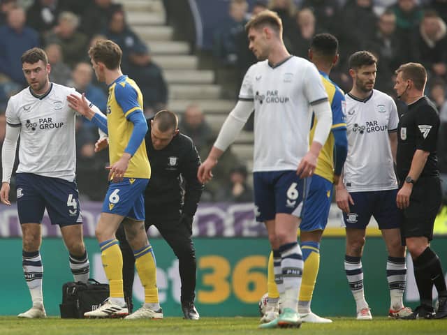 Preston North End's Ben Whiteman leaves the pitch following treatment for a first half injury