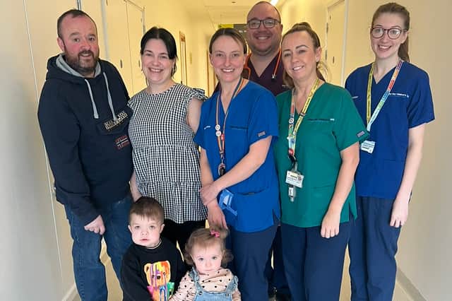 Shaemus pictured with his family and Alder Hey hospital staff.