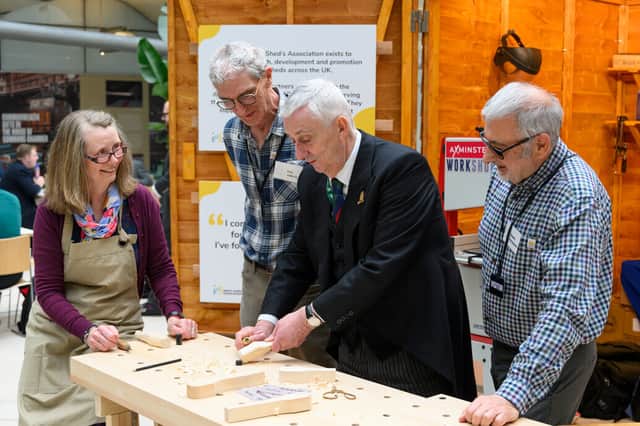 Ian (second from left) says the Men's Shed gave him a purpose again after retiring.