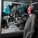 Brian Finney with exhibits about his father Sir Tom at the Pride of the Pitch Exhibition launch at Lancashire Archives, Preston
