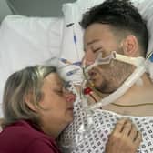 Susan Haworth with her son Jack Jermy-Doyle in hospital prior to his death.   The mum of a trainee barrister who died after a fatal punch on a night out has urged people to stop 'needless violence.'  