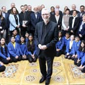 Bishop of Burnley, Rev. Dr Joe Kennedy, surrounded by many of those who attended the Burnley Faith Centre announcement on Friday.