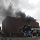 Thick black smoke can be seen rising from the under construction civil service offices in Talbot Gateway this morning
