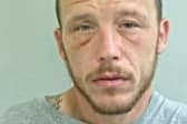Michael Dixon is wanted in connection with a burglary at a business premises in Ashton-on-Ribble (Credit: Lancashire Police)