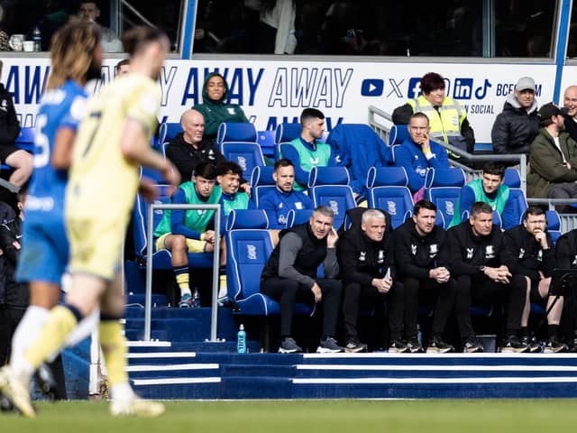 Preston North End's bench looks on