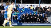 Preston North End's bench looks on