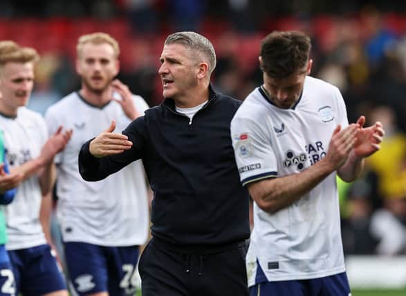 Ryan Lowe applauds the fans at the final whistle 