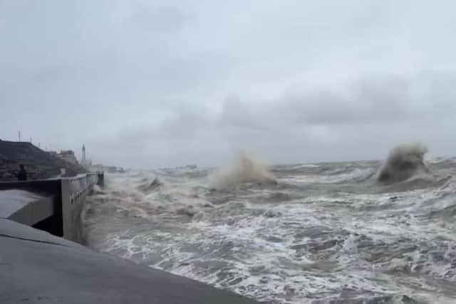 Large waves battered the coast as winds of up to 65mph swept across the resort (Credit: Dave Nelson)