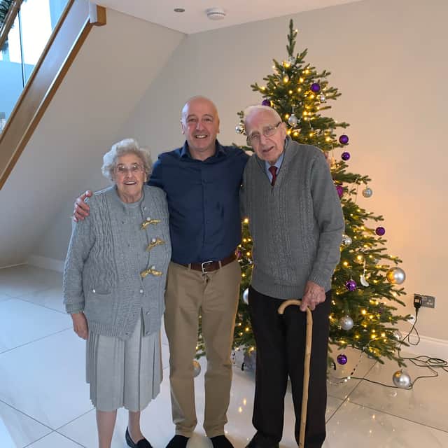 Graham pictured with his late parents Jean and Eddie who he lost in January 2023. 