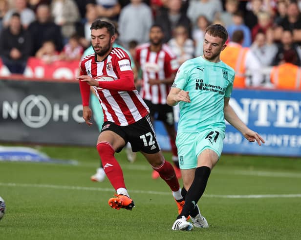 Reece Cole (L) was playing non-league football until the summer of 2023. The Exeter City midfielder now has three EFL clubs interested in him. (Photo by Pete Norton/Getty Images)