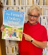 Caroline with one of her many books. 