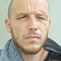 Michael Dixon is wanted in connection with a burglary at a business premises in Plungington (Credit: Lancashire Police)