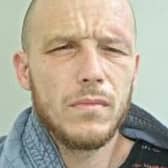 Michael Dixon is wanted in connection with a burglary at a business premises in Plungington (Credit: Lancashire Police)