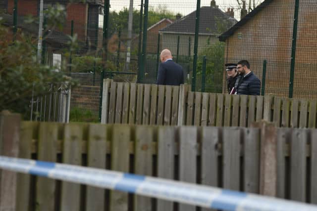 Detectives at the scene of a stabbing in Ashton this morning