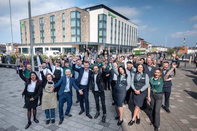 Actor Jack P Shepherd, who plays David Platt in TV soap Coronation St, cuts the ribbon to offically open the new Holiday Inn on Talbot Road - and meets the staff