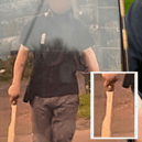 A chilling image of man walking the streets of Preston armed with a machete just moments after a stabbing