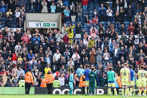 Preston North End players applaud the fans at the final whistle 