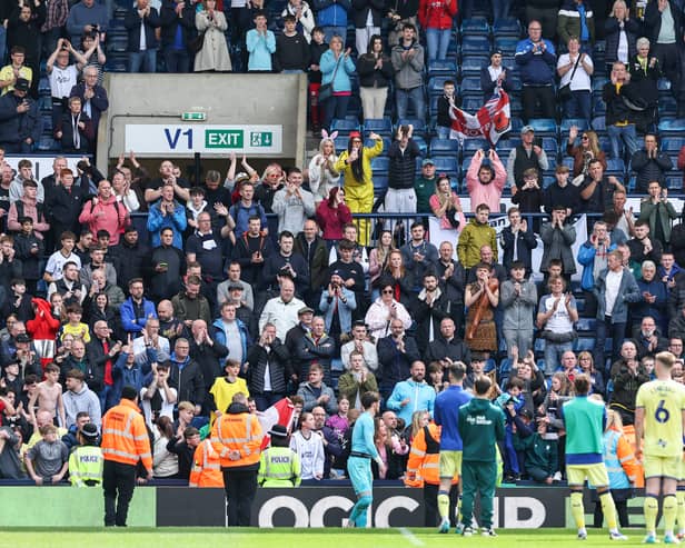 Preston North End players applaud the fans at the final whistle 