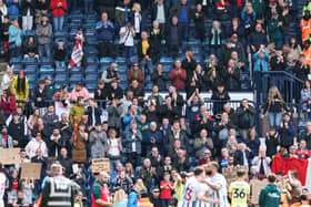 Preston North End fans applaud their team at the final whistle. North End lost to West Brom on the final day