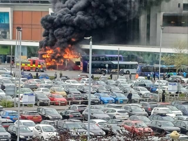 The bus engulfed in flames at Blackburn bus station today. Picture credit: Steve Hartley