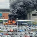 The bus engulfed in flames at Blackburn bus station today. Picture credit: Steve Hartley