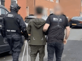 Amanj Hasan Zada being detained by National Crime Agency officers
