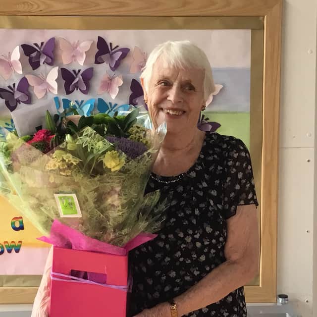 Thelma, pictured with flowers that were presented to her at a special ceremony to thank her for her 45 years of service.