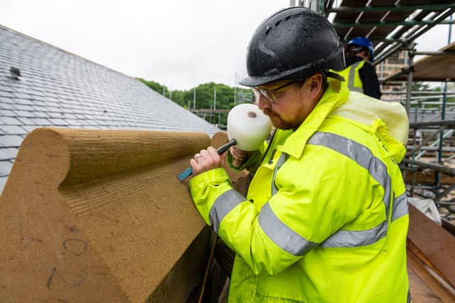 David Duffy, Site Manager works on one of the newly installed elements of the roof. (Photo: Kelvin Lister-Stuttard)