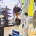 Kavan Conroy captured on CCTV riding a moped in JD sports.  