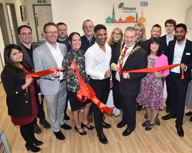 Cllr Chris Lomax, Mayor of South Ribble Borough Council, cuts the ribbon with the local team, to officially open Optegra Eye Clinic in Preston.