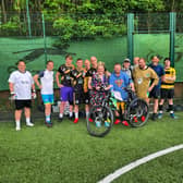 March being gifted his new bike by players at Senior Soccer.