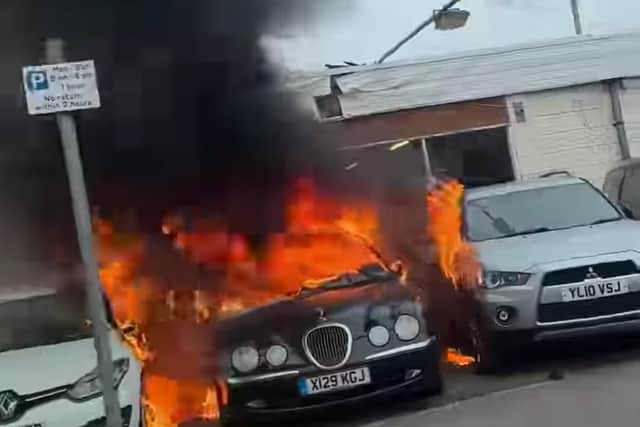 A Jaguar in flames at Hesketh Cars showroom in Bispham Road, Cleveleys (Credit: Carly Morgan)