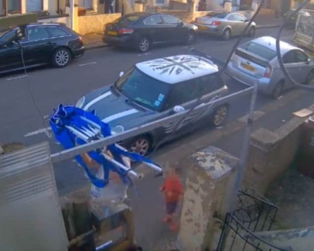 Brazen thief caught on CCTV stealing chained-up gazebo from front ...