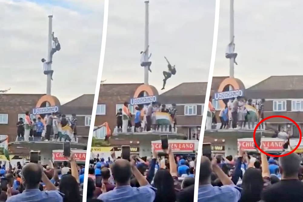 This is the heart-stopping moment an Indian fan plunged 30ft after trying to tie a flag around a pole during wild T20 World Cup celebrations. 