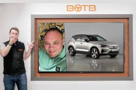 BOTB presenter Christian Williams with a photo of HGV driver Andrew Mayor and the car he has won!