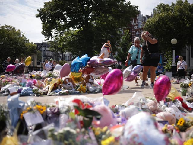 Flowers and tributes outside the Atkinson Art Centre in Southport