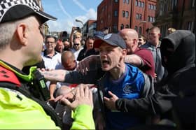Protesters initially gathered outside Blackpool cenotaph before marching through the town. Credit: PA