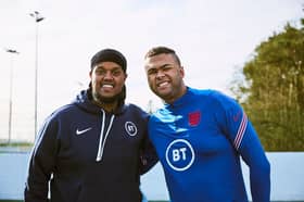 Rainbow (right) alongside popular YouTuber Chunkz during a video shoot.