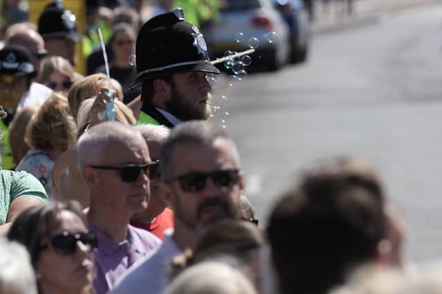 Mourners gather for the funeral of nine-year-old Alice Da Silva Aguiar, a victim of last week's knife attack in Southport, outside St Patrick's Catholic Church.