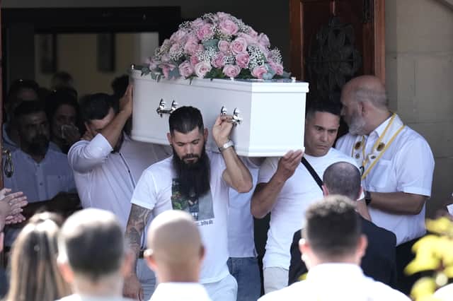The coffin of nine-year-old Alice Da Silva Aguiar is carried out of her funeral at St Patrick's Catholic Church.